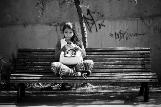 girl sitting on a bench